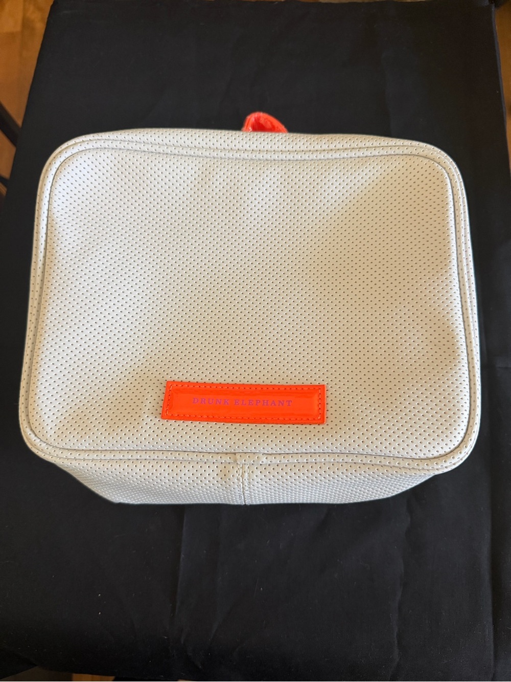 Drunk Elephant Perforated white makeup Bag with Orange Accent new without tags